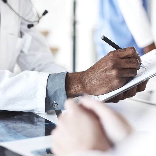 hand writing on notepad