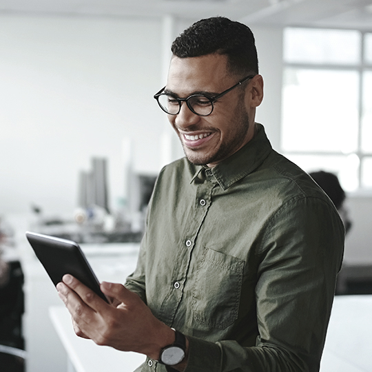 Man looking at tablet