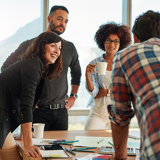 colleagues laughing in a meeting
