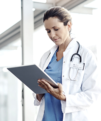 Doctor looking at tablet