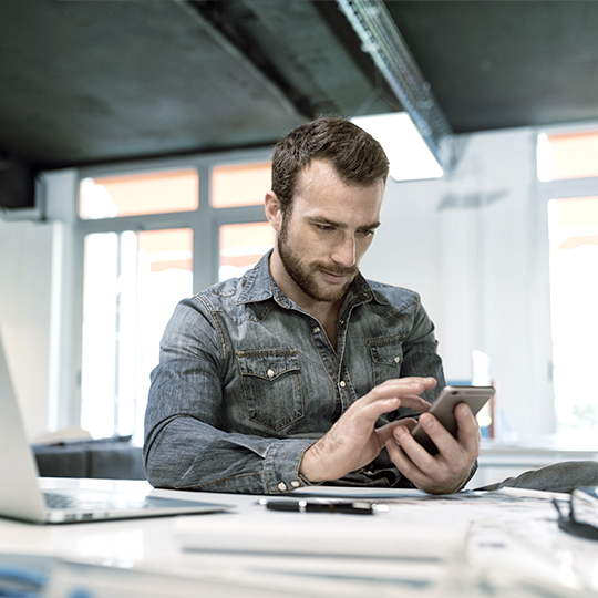 Man looking at smartphone